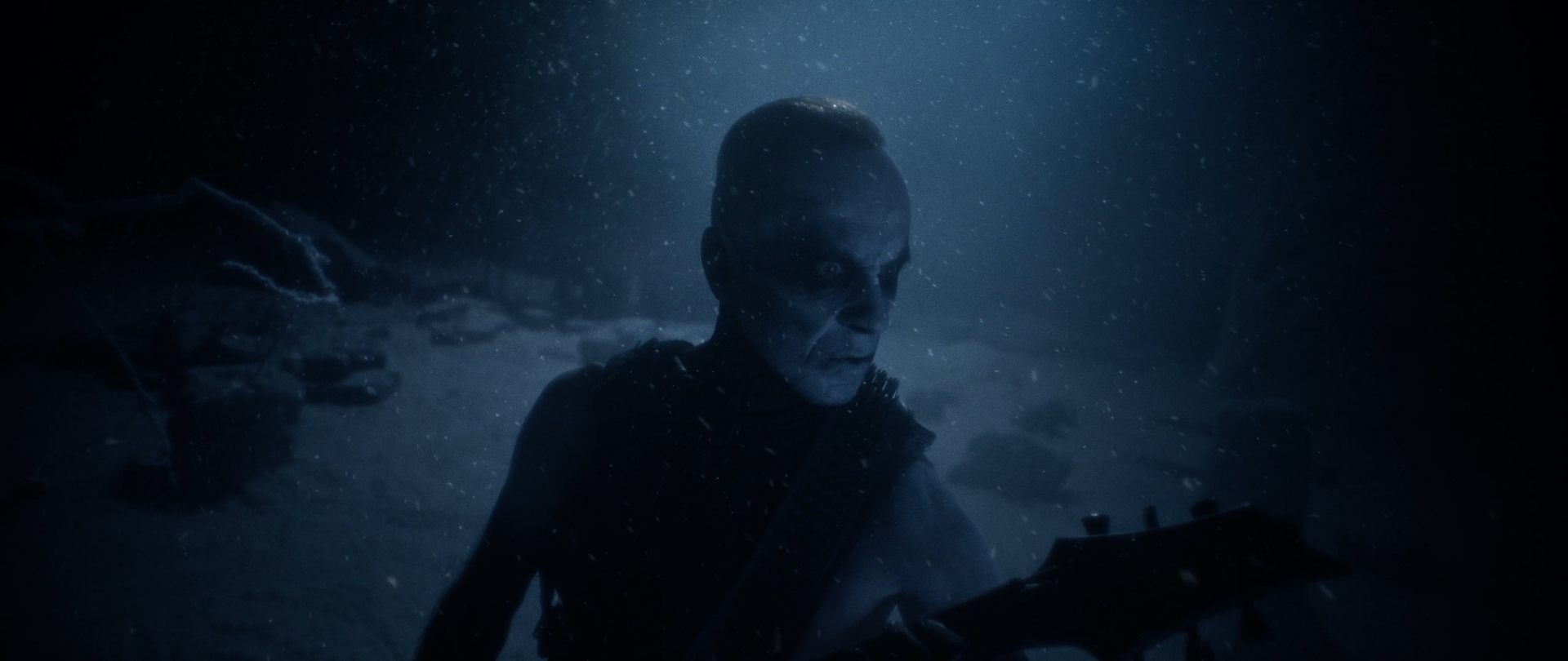 Behemoth Mystic still - corpsepainted guitarist glaring into the camera through falling snow