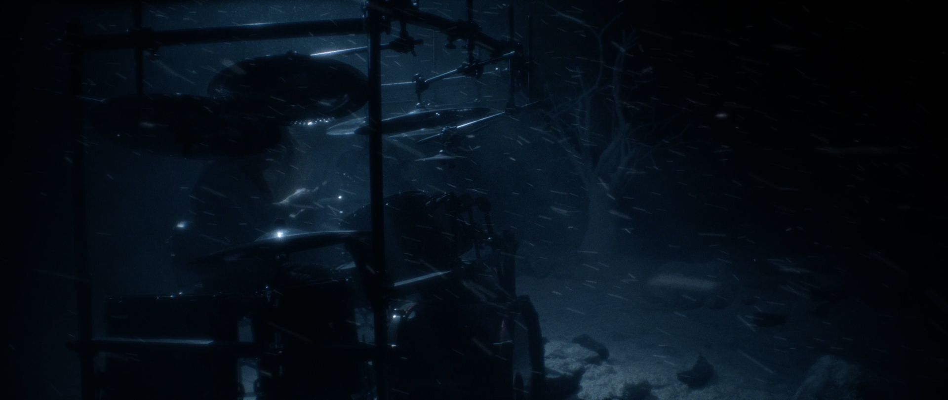Behemoth Mystic still - drum kit silhouetted in a blue snowstorm beside bare winter trees
