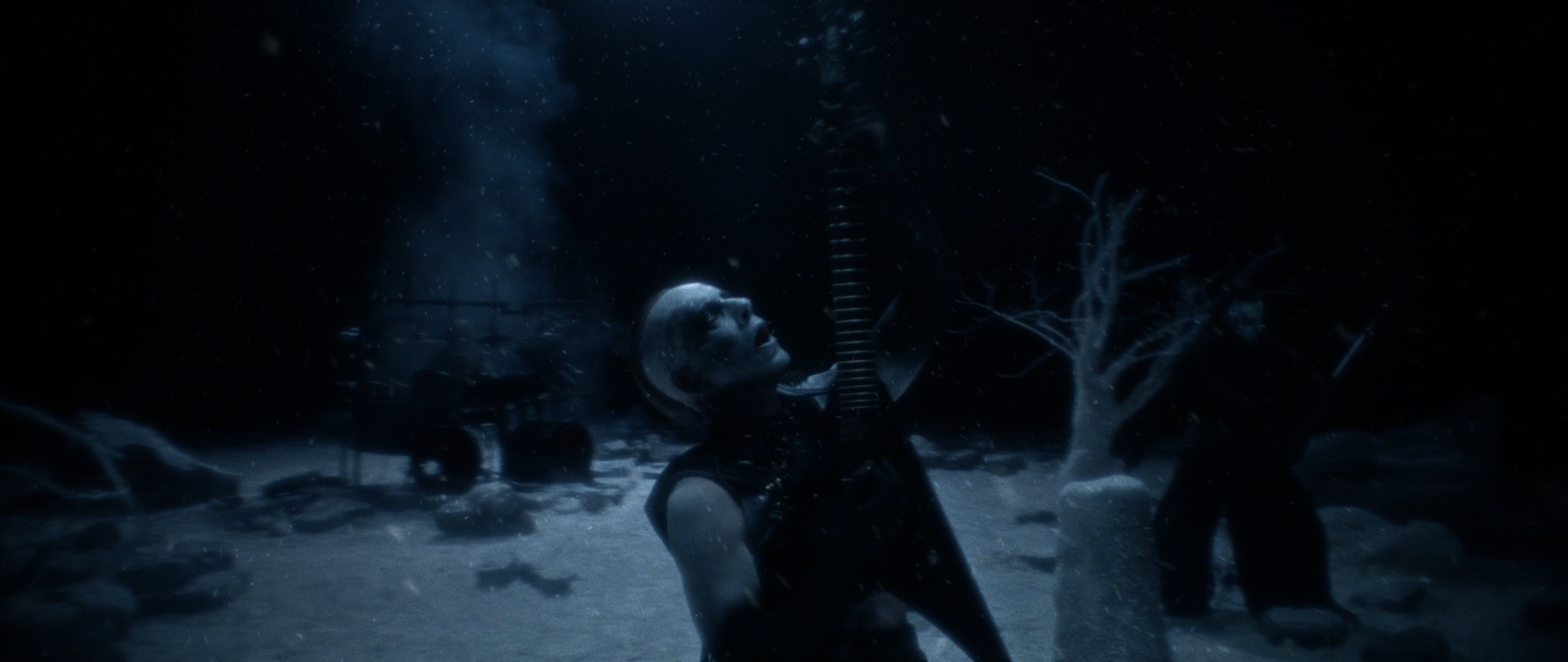 Behemoth Mystic still - corpsepainted guitarist head thrown back mid-performance, drummer in the snowy background