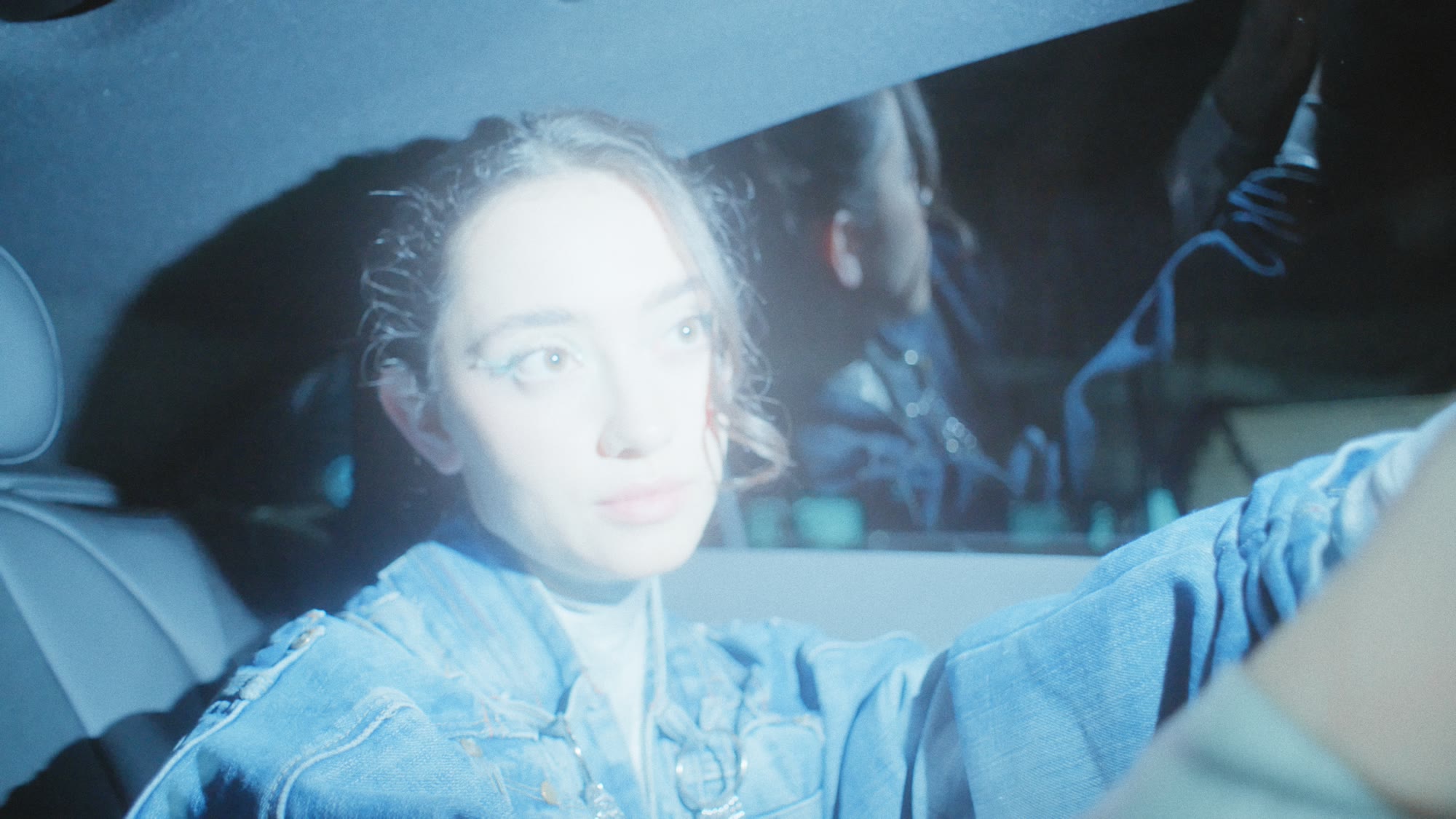 Close-up of a model's face inside a car, spiked hair backlit - Wrocław Fashion Week