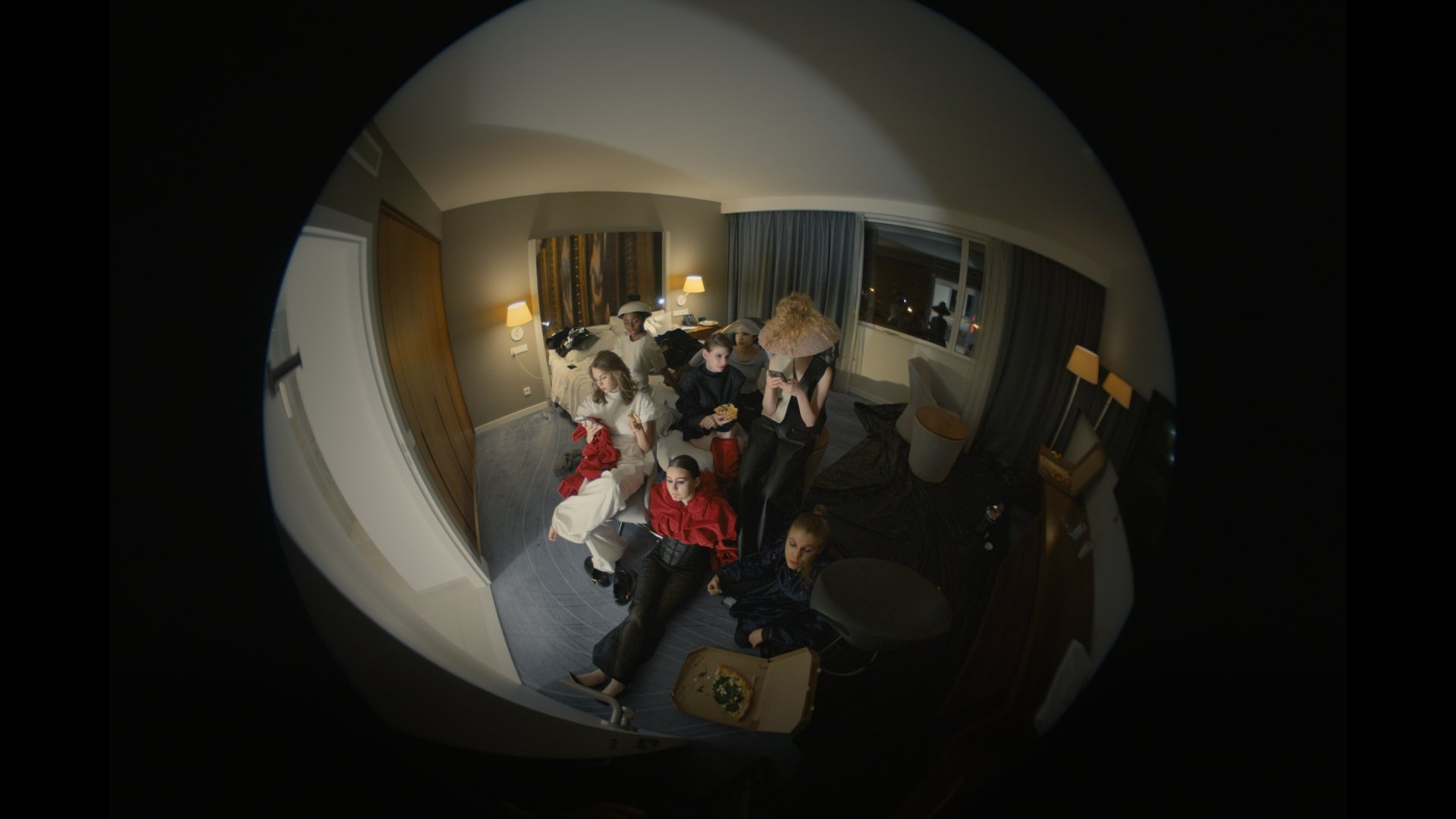 Fisheye wide shot of a group gathered in a hotel room - Wrocław Fashion Week 2025