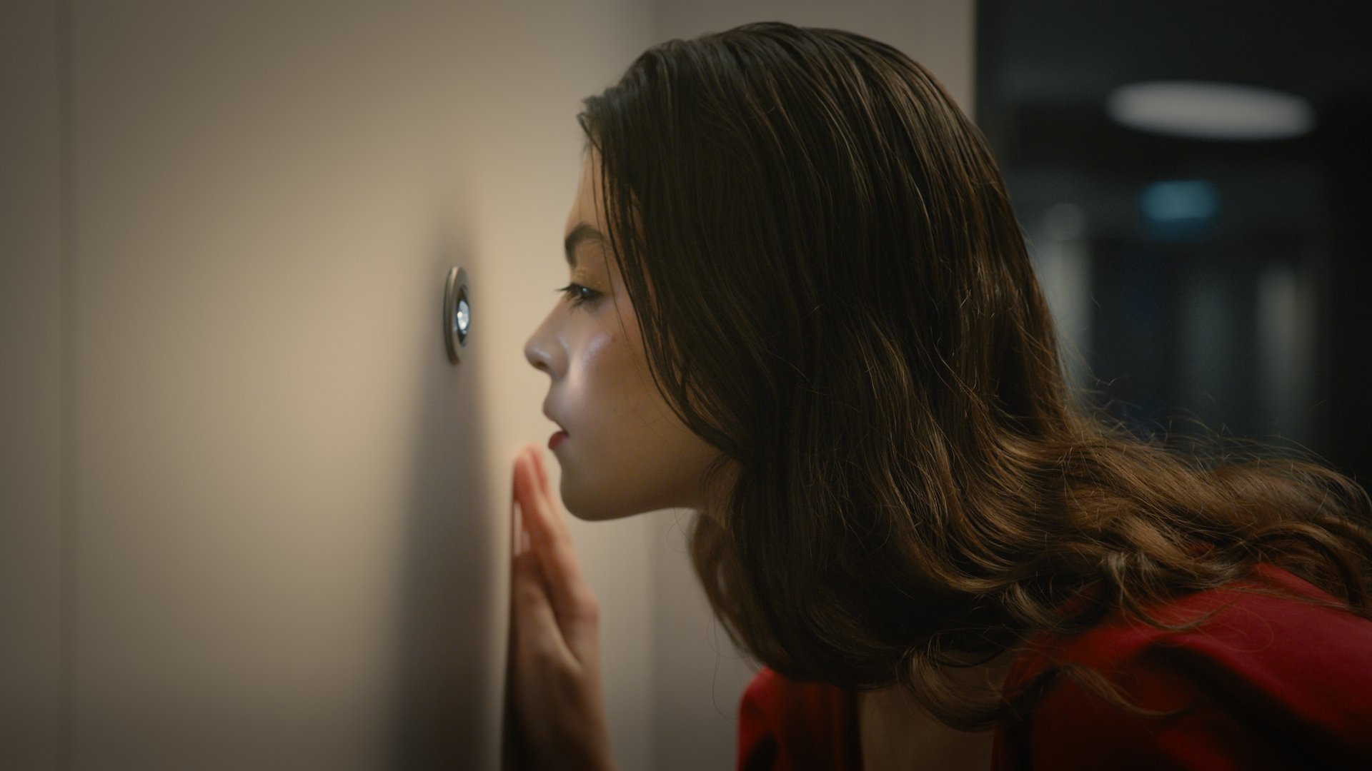 Close profile of a woman peering around a doorway, alternate take - Wrocław Fashion Week 2025