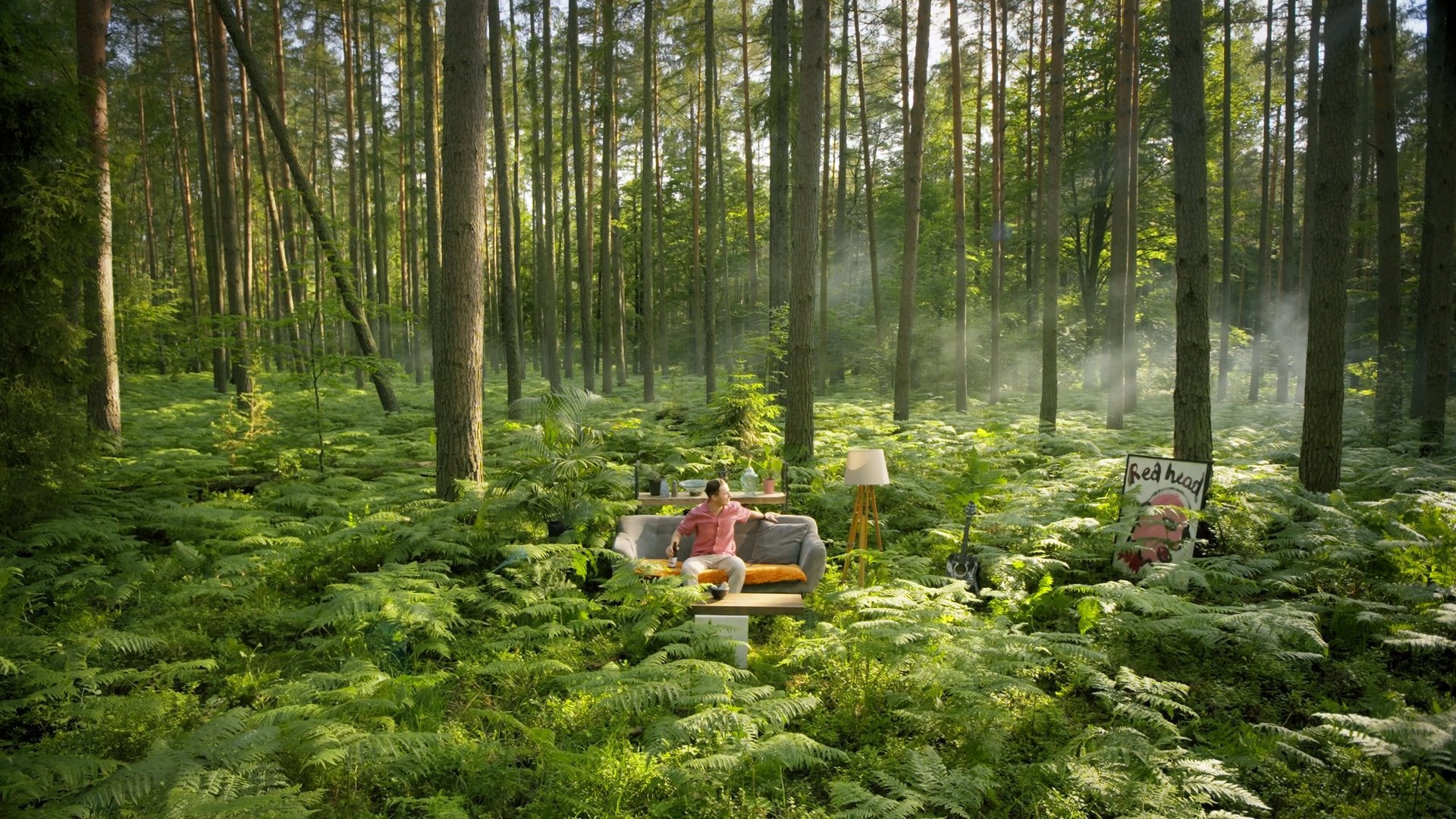 A living room set built inside a misty forest clearing - Miastolas commercial