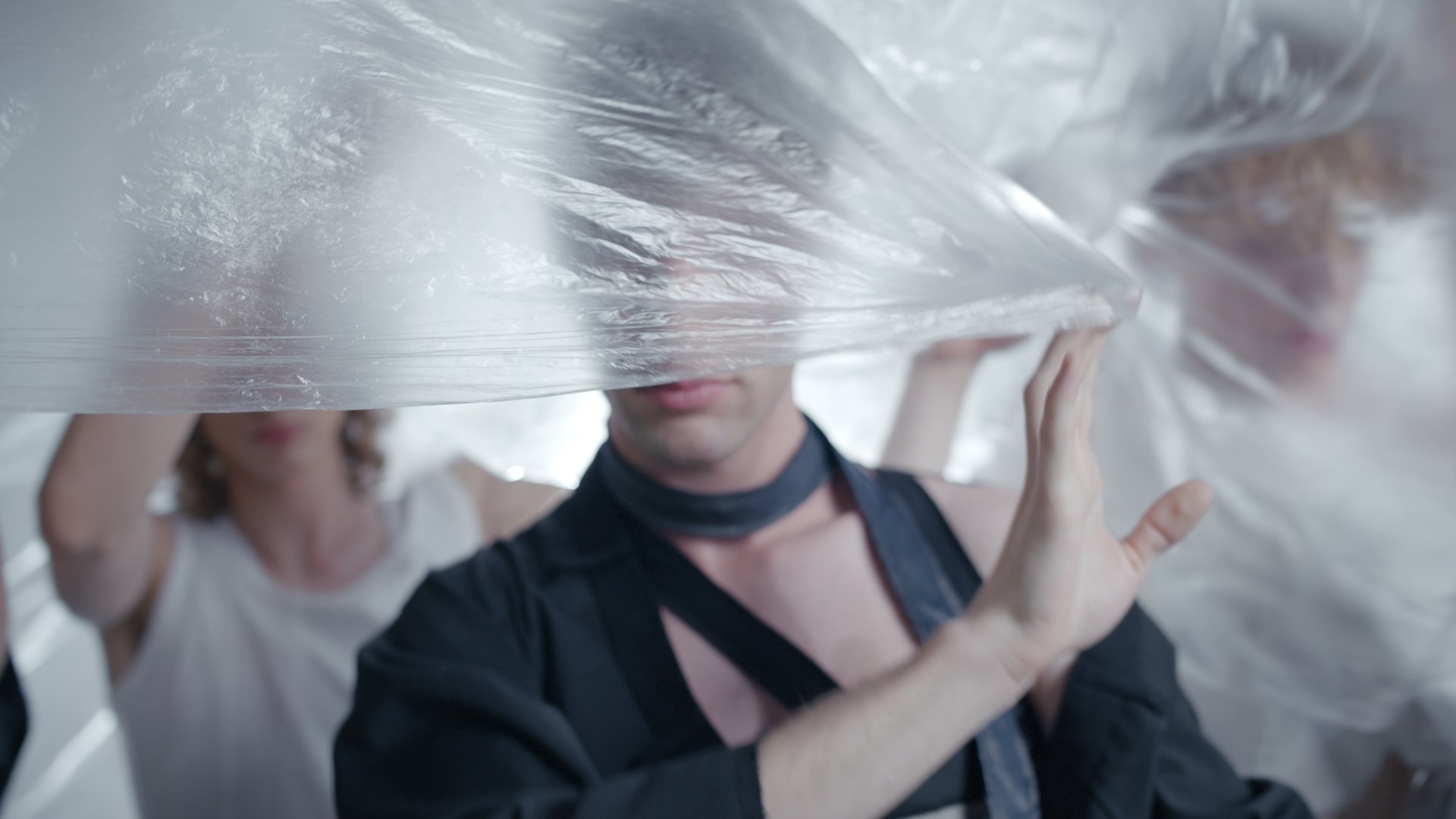 A face wrapped in cellophane, dark styling - Wrocław Fashion Week Collections