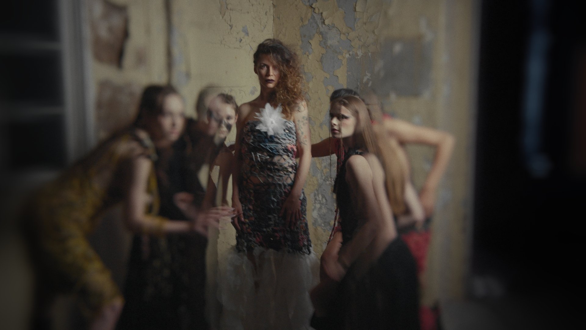 Group of models in gold patterned outfits inside an industrial space - Wrocław Fashion Week Collections