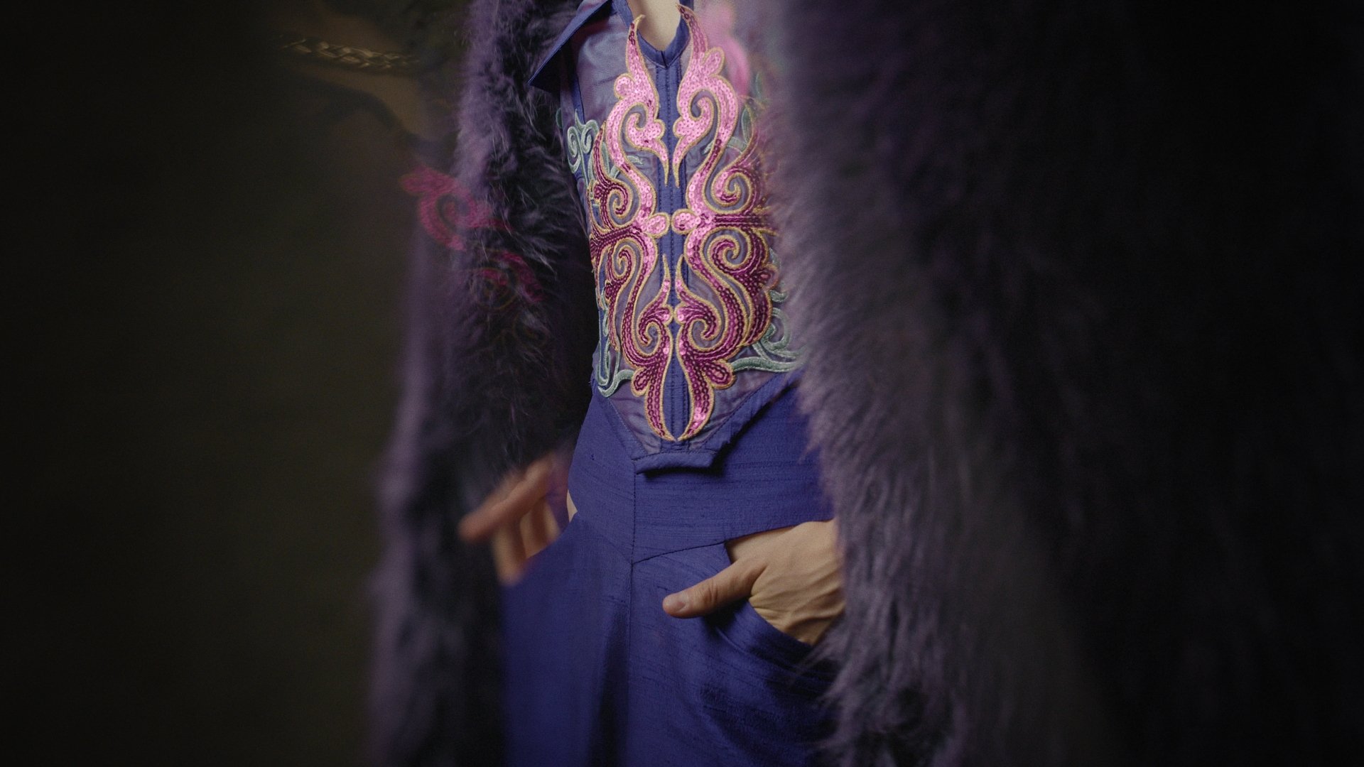 Portrait of a figure in an ornate purple and pink jacket - Wrocław Fashion Week Collections