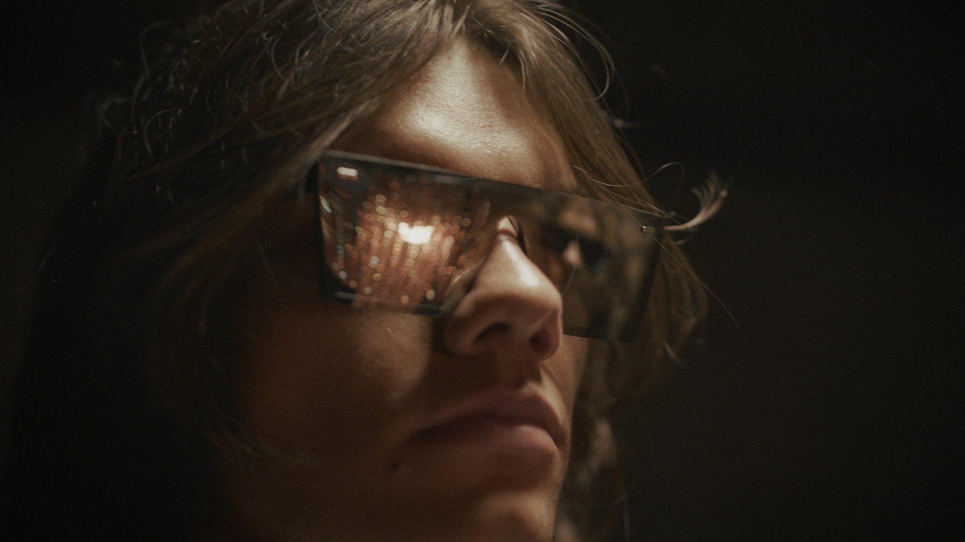 Close-up of a figure with long hair and sunglasses - Wrocław Fashion Week Collections