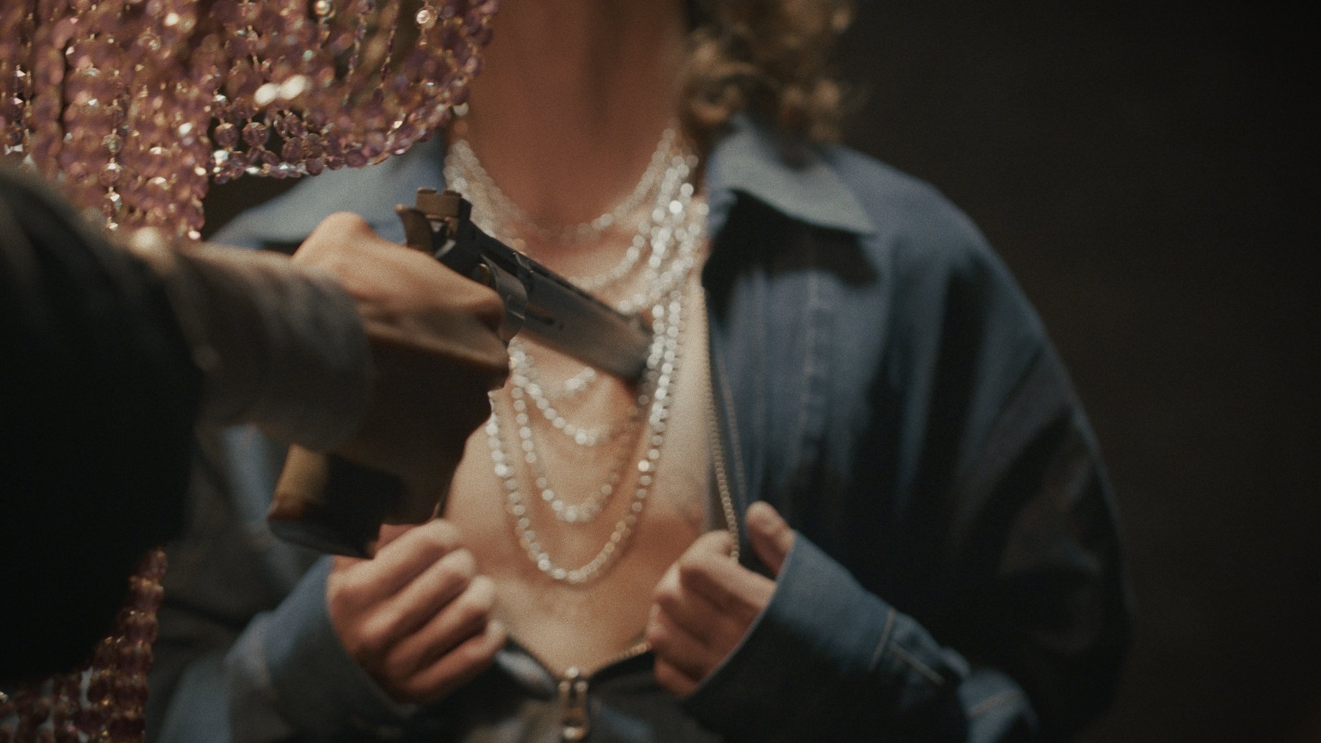 Close-up of hands adjusting a pearl necklace - Wrocław Fashion Week Collections